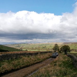 Land Rovers climbing a byway in the Dales
