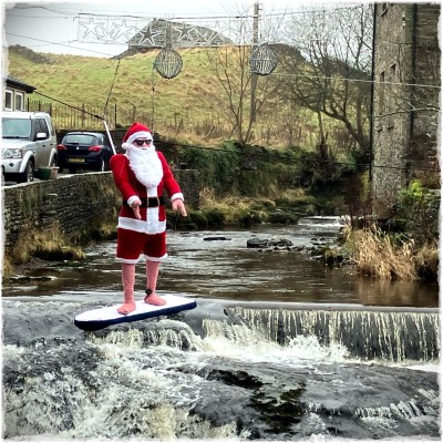 Santa on a paddleboard in Wensleydale
